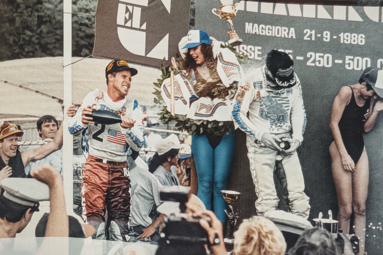Full-color 1950s-style motocross podium celebration